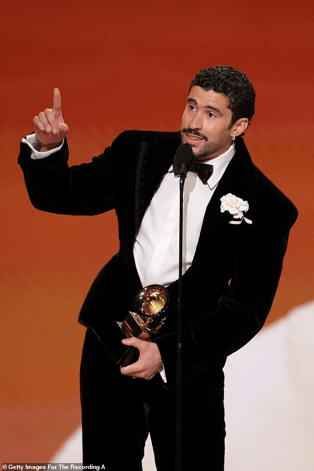 Bad Bunny didn’t ease into his Grammy speech — he detonated it. As he stepped up to accept Best Música Urbana Album at the 2026 Grammys, the global superstar skipped tradition and went straight for a message that froze the room. “Before I thank God,” he said, voice steady, eyes locked forward, “I’m going to say: ICE out.” No smile. No pause. Just a line that cut through the applause and instantly set social media on fire. The Puerto Rican icon, fresh off one of the biggest nights of his career and days away from headlining the Super Bowl LX Halftime Show, used the spotlight not to celebrate himself — but to draw a hard line. 2 image 519