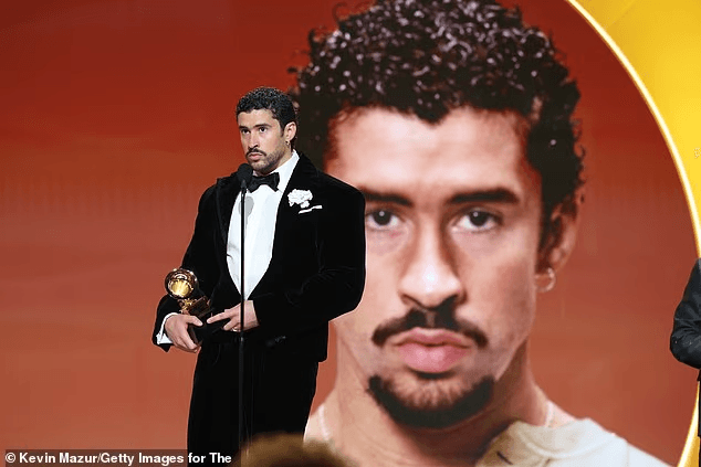 Bad Bunny didn’t ease into his Grammy speech — he detonated it. As he stepped up to accept Best Música Urbana Album at the 2026 Grammys, the global superstar skipped tradition and went straight for a message that froze the room. “Before I thank God,” he said, voice steady, eyes locked forward, “I’m going to say: ICE out.” No smile. No pause. Just a line that cut through the applause and instantly set social media on fire. The Puerto Rican icon, fresh off one of the biggest nights of his career and days away from headlining the Super Bowl LX Halftime Show, used the spotlight not to celebrate himself — but to draw a hard line. 5 image 522